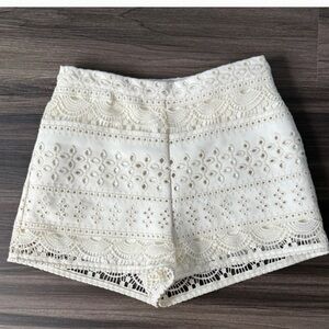 Flattering high waist w/intricate lace detail,side pockets, back zipper closure.